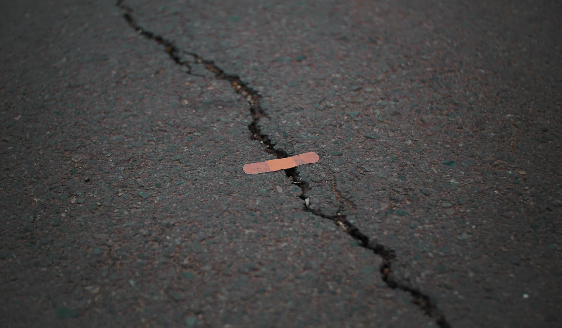 Crack in concrete covered with a bandage